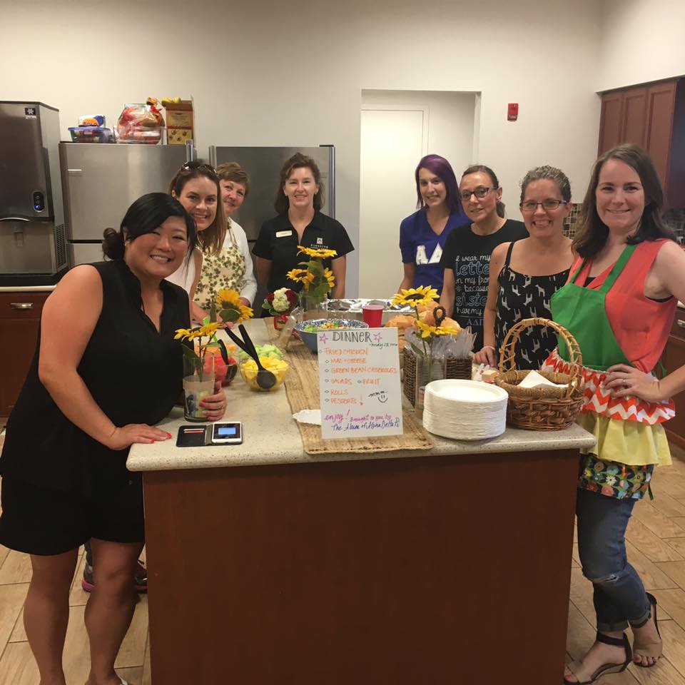 Volunteers from ADPi preparing dinner at the Cambridge House