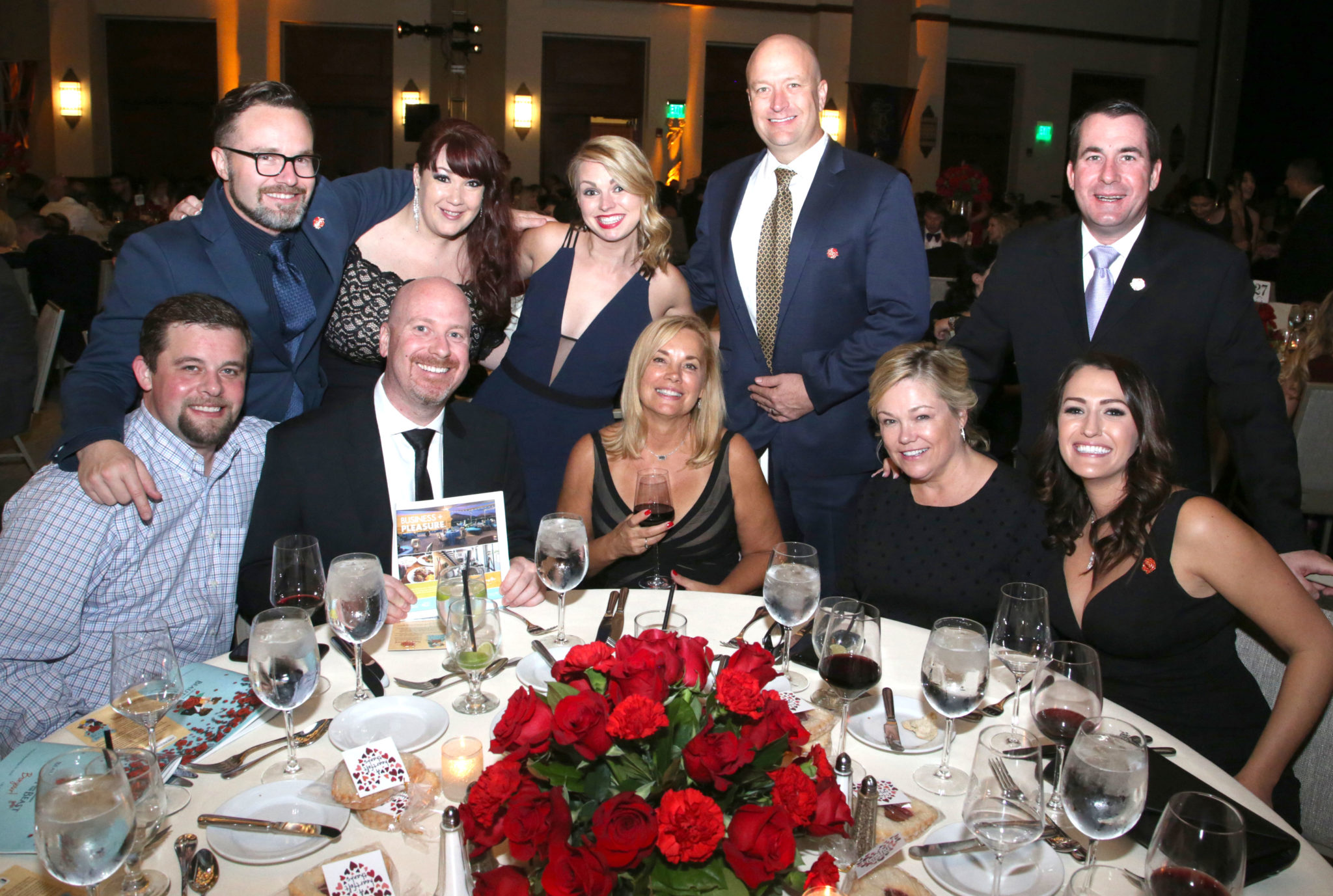 McNight Gala guests from Hotel Valley Ho pose at their table in the Camelback Inn ballroom