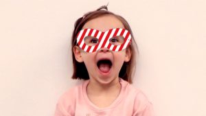 Girl in red and white striped maskk